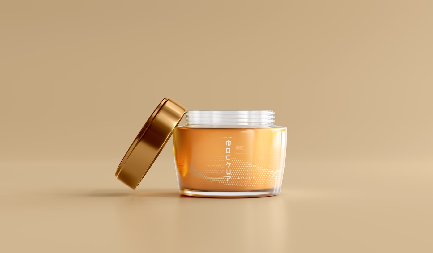 a jar of honey with a gold lid